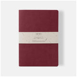 Ciak Mate A4 lined notebook in red with soft vegan leather cover and 64 cream-colored pages for elegant writing.