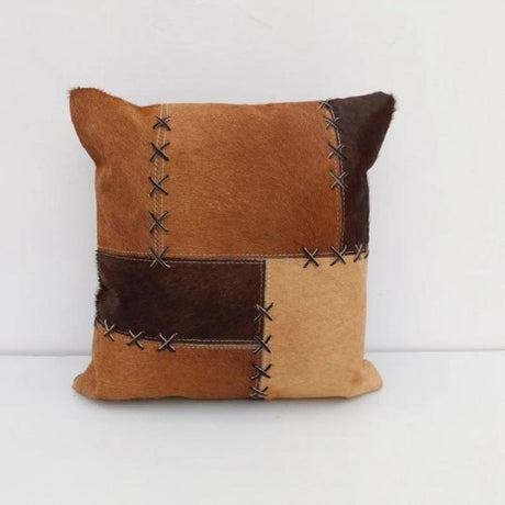 Exotic brown leather cushion cover, 40x40cm, featuring unique cowhide patterns and a durable zipper closure for easy use.