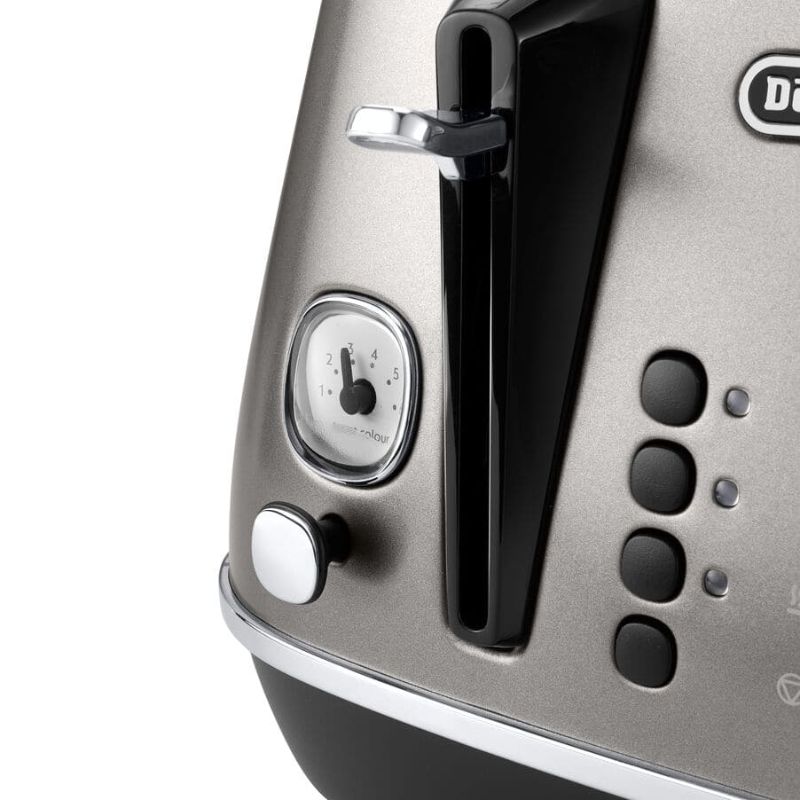 De'Longhi Distinta Titanium 4 Slice Toaster with matte finish, extra-wide slots, and six browning settings for perfect toast.