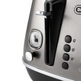 De'Longhi Distinta Titanium 4 Slice Toaster with matte finish, extra-wide slots, and six browning settings for perfect toast.