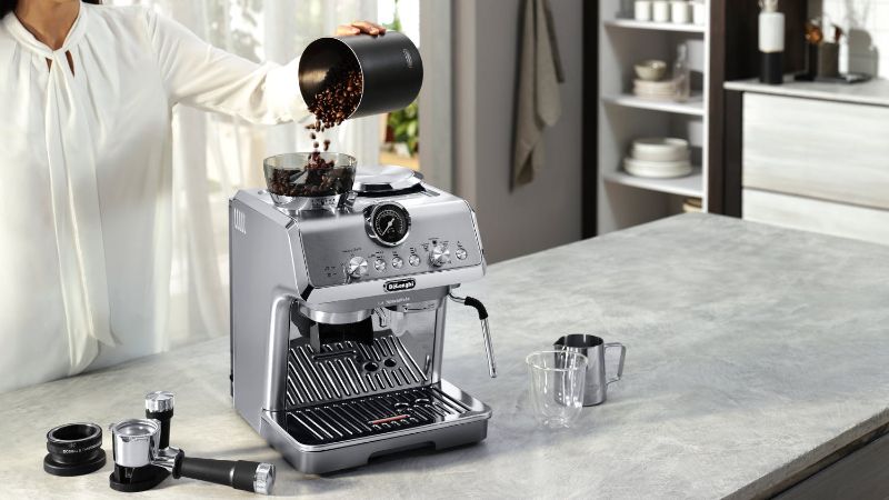 De'Longhi Arte Metal Pro Cold Brew coffee machine in stainless steel, featuring cold brew technology and built-in grinder.