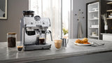 De'Longhi Arte Metal Pro Cold Brew coffee machine in stainless steel, featuring cold brew technology, grinder, and steam wand.