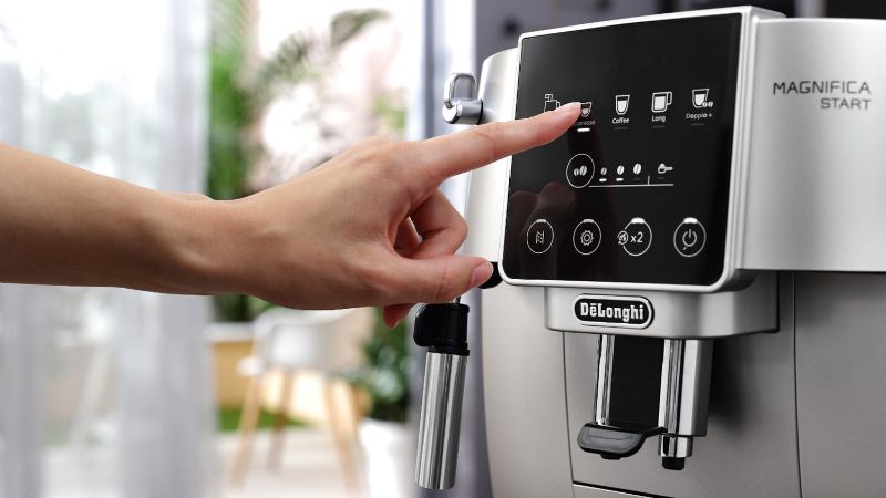 De'Longhi Magnifica Start espresso machine in silver-black with integrated grinder and milk frother for customizable coffee.