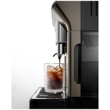 De'Longhi Eletta Explore Coffee Machine in sleek titanium, featuring a TFT display, milk frother, and Wifi connectivity for custom brews.