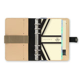 Elegant nude leather Filofax organiser with a ring mechanism, includes diary and essential organizational tools.