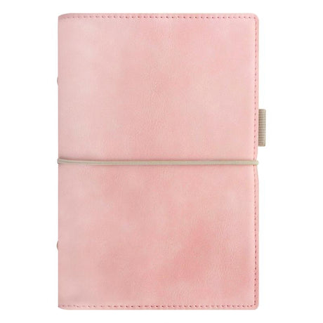 Pale pink faux-leather Filofax organiser with contrast stitching, elastic closure, and spacious pockets for efficient planning.