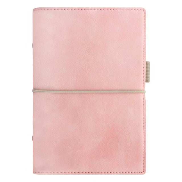 Pale pink faux-leather Filofax organiser with contrast stitching, elastic closure, and spacious pockets for efficient planning.