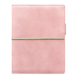 Pale pink Filofax Domino Soft Pocket organiser with a leather-like finish, featuring an elastic closure and versatile interior pockets.