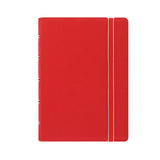 Stylish red Filofax Pocket Notebook with elastic closure, twin wire spine, and movable pages for flexible organization.