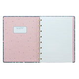 A5 refillable notebook with floral design, gold foil accents, 56 sheets of fountain pen-friendly lined paper, and elastic closure.