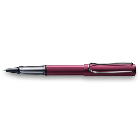 Lamy Al-Star Rollerball in metallic dark purple, featuring a transparent grip and ergonomic design for comfortable writing.