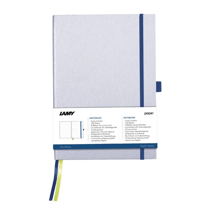 Elegant silver Lamy A6 notebook with ocean blue edges, featuring 192 pages of bleedproof paper and pen loop for easy writing.