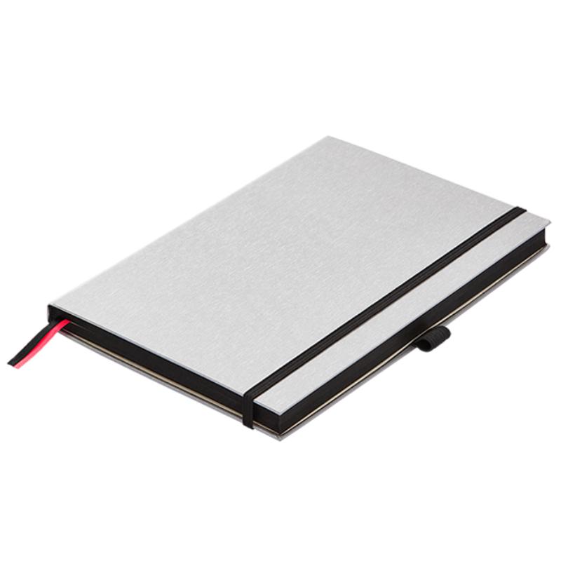 Lamy A5 silver and black hardcover notebook with 192 bleedproof pages, elastic closure, pen loop, and two bookmarks.