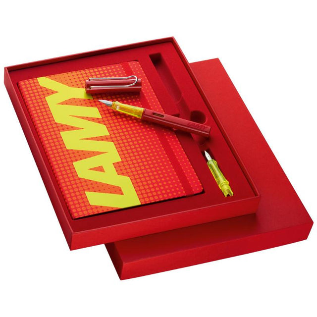 Lamy Al-Star Glossy Red Notebook Set featuring a vibrant red fountain pen, neon yellow grip, and exclusive notebook.