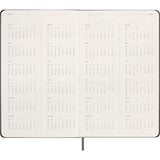 Moleskine large undated weekly planner in black with ivory pages, elastic closure, ribbon bookmark, and customizable stickers.