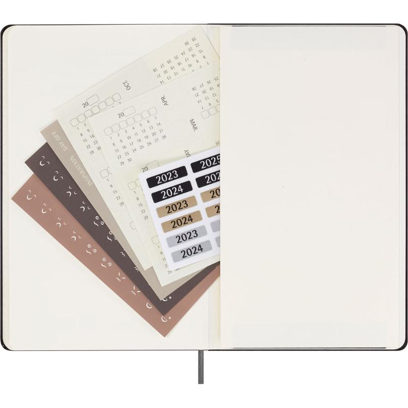 Moleskine undated weekly planner in black with ivory pages, elastic closure, and customizable month dividers for organization.