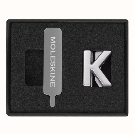 Silver Moleskine Pins K, durable zinc alloy letters for personalizing notebooks with initials or inspirational words.