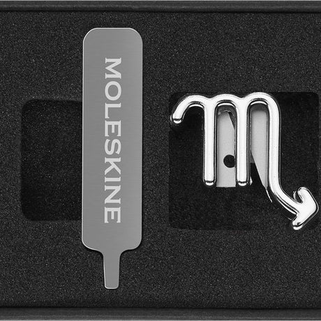 Silver Scorpio pin by Moleskine, a zodiac-inspired accessory for notebooks, adding a personal and stylish touch.