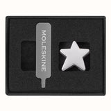 Elegant silver star pin for Moleskine notebooks, crafted from zinc alloy, adds style and personalization to your note-taking.