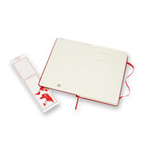 Moleskine Large Scarlet Red Hard Cover Notebook with ruled ivory pages, elastic closure, and expandable inner pocket.