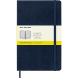 Moleskine Notebook in sapphire blue with hard cover, elastic closure, ivory pages, and expandable inner pocket for creatives.