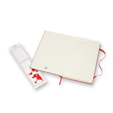 Large scarlet red Moleskine notebook with hard cover, elastic closure, and ivory pages for notes and sketches.