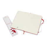 Large scarlet red Moleskine notebook with dotted pages, elastic closure, and expandable pocket for versatile note-taking.