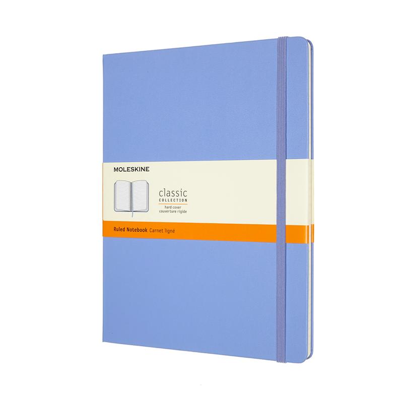 Moleskine XL ruled notebook in Hydrangea Blue, featuring ivory pages, elastic closure, bookmark ribbon, and expandable pocket.