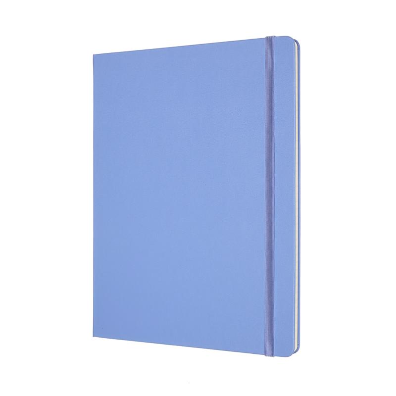 Moleskine XL notebook in Hydrangea Blue, featuring ruled pages, elastic closure, and expandable pocket for notes.