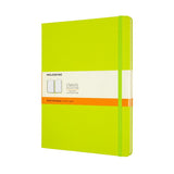 Moleskine XL ruled notebook in vibrant Lemon Green with ivory pages, elastic closure, and expandable back pocket.