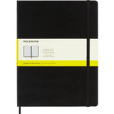 Moleskine XL black hard cover notebook with square format, elastic closure, ivory pages, and expandable back pocket for notes.