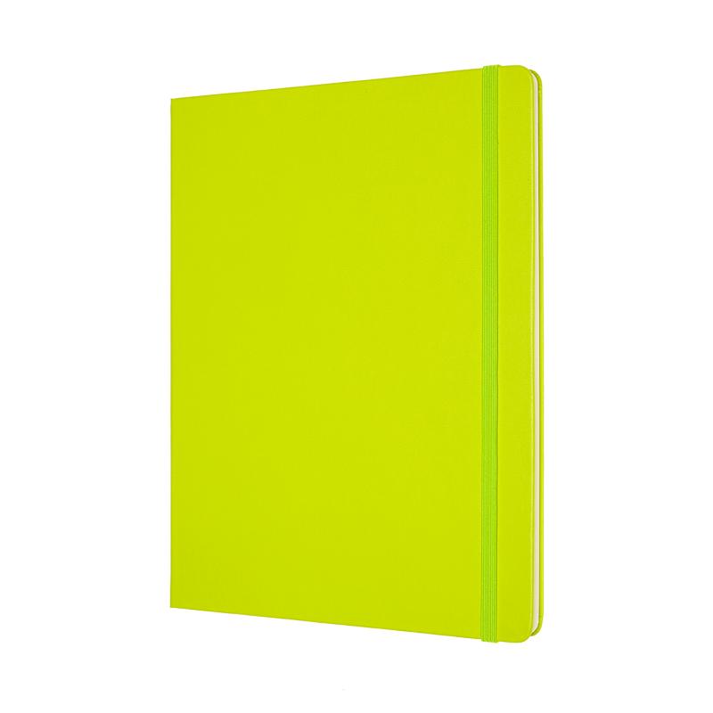 Moleskine XL notebook in vibrant lemon green, featuring smooth ivory pages, elastic closure, and expandable pocket for notes.