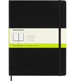 Moleskine XL black notebook with hard cover, ivory pages, elastic closure, and expandable pocket for notes.