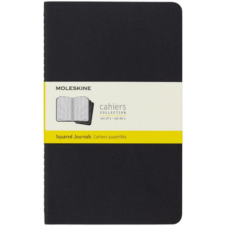 Three large black Moleskine Cahier journals with customizable covers, rounded corners, and detachable pages for versatile note-taking.