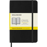 Moleskine Pocket Notebook in black, featuring a soft cover, square design, elastic closure, and ivory acid-free pages.