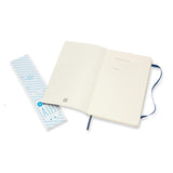 Sapphire blue Moleskine Notebook with ruled pages, elastic closure, and expandable pocket for storing notes and mementos.