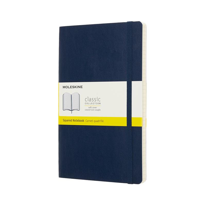 Sapphire blue Moleskine notebook with soft cover, elastic closure, ivory pages, and expandable back pocket for notes.