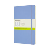 Moleskine Large Plain Notebook in Hydrangea Blue featuring a soft cover, acid-free pages, elastic closure, and ribbon bookmark.