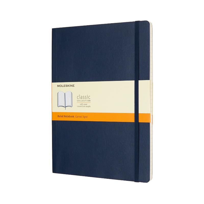 Moleskine XL Sapphire Blue Soft Cover notebook with ruled pages, elastic closure, bookmark, and expandable pocket for notes.