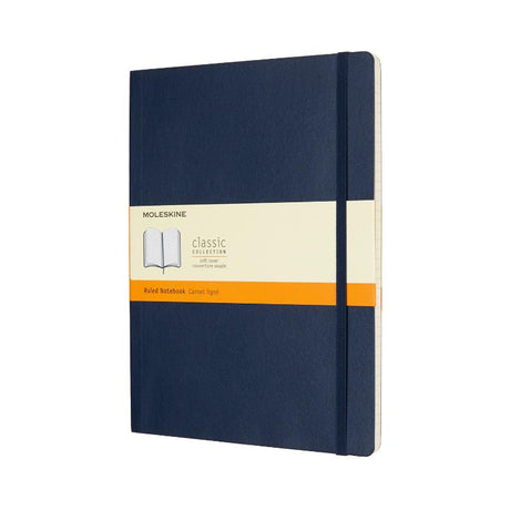 Moleskine XL Sapphire Blue Soft Cover notebook with ruled pages, elastic closure, bookmark, and expandable pocket for notes.