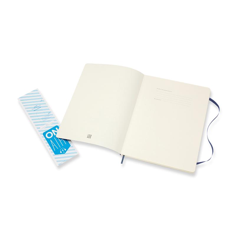 Sapphire blue Moleskine XL notebook with ruled pages, elastic closure, ribbon bookmark, and expandable back pocket.