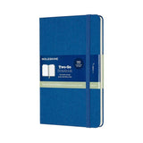 Moleskine Two-Go Notebook in Lapis Blue, featuring ruled and plain pages, durable cover, double bookmarks, and expandable pocket.