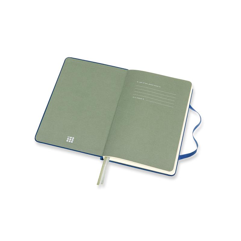 Medium ruled and plain Moleskine Two-Go Notebook in Lapis Blue, featuring a durable cover, double bookmarks, and expandable pocket.