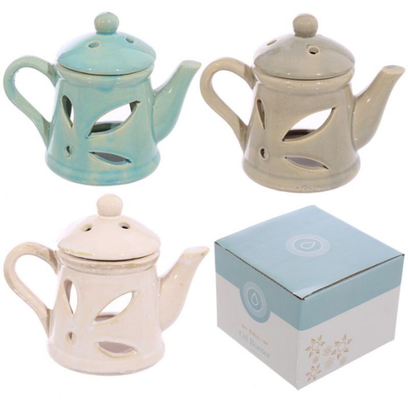 Elegant ceramic teapot oil burners with lids, 12cm high, perfect for creating soothing aromas in any decor. Set of 3 assorted styles.