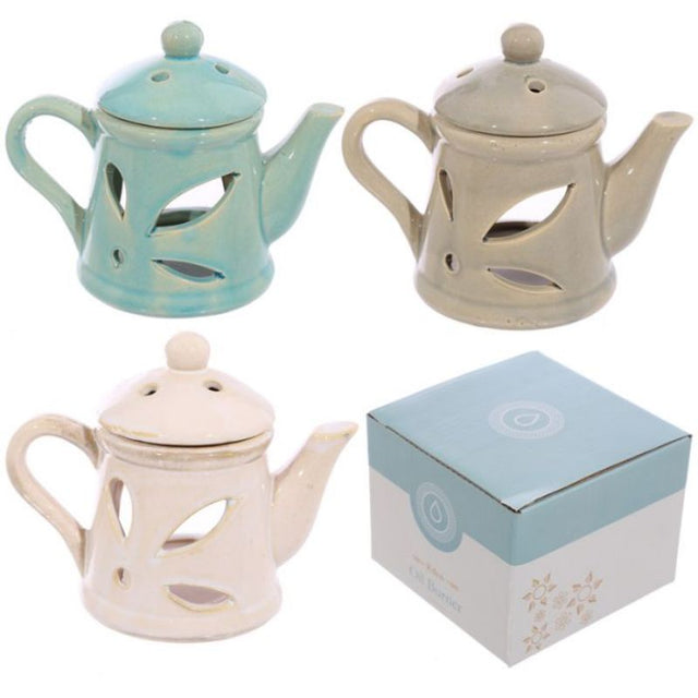 Elegant ceramic teapot oil burners with lids, 12cm high, perfect for creating soothing aromas in any decor. Set of 3 assorted styles.