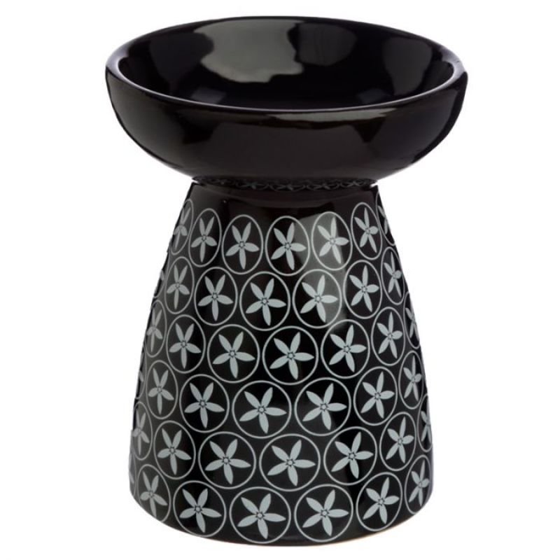 Ceramic oil and wax burners featuring an elegant floral pattern, perfect for enhancing home ambiance with fragrance.