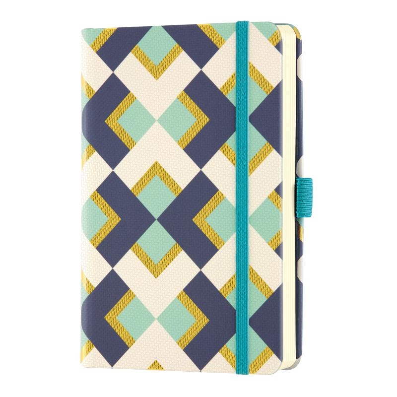 Elegant Castelli Oro notebook with geometric designs, gold ribbon marker, and ruled ivory pages for chess enthusiasts.