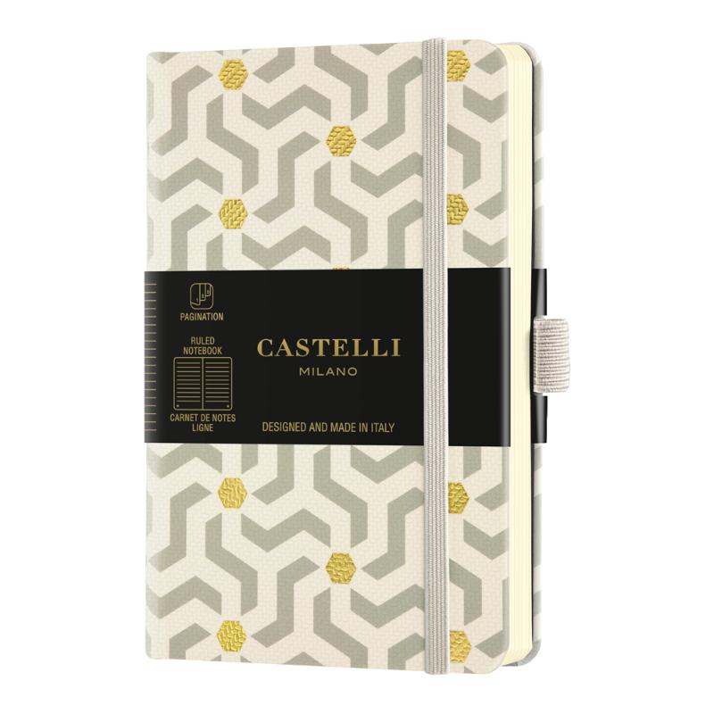 Castelli Notebook Oro with geometric design, ivory ruled pages, gold marker, and eco-friendly certification.