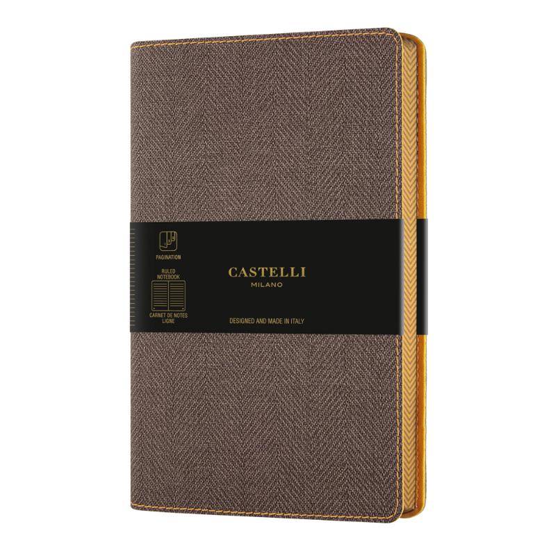 Castelli Harris Pocket Ruled Notebook in Tobacco Brown, featuring a tweed cover, ivory pages, and ribbon marker for elegant note-taking.