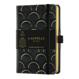 Elegant Castelli Copper and Gold notebook with embossed design, ruled ivory pages, gold edges, and eco-friendly cover.